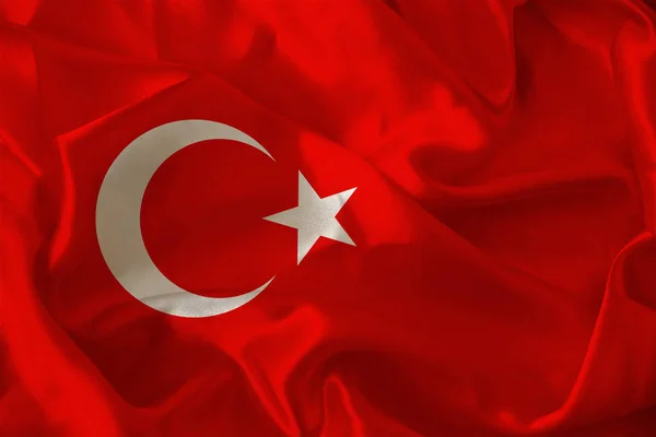 Fotó a gyönyörű színes nemzeti zászló modern állam Törökország a texturált szövet, koncepció a turizmus, kivándorlás, gazdaság és politika, closeup — Stock Fotó