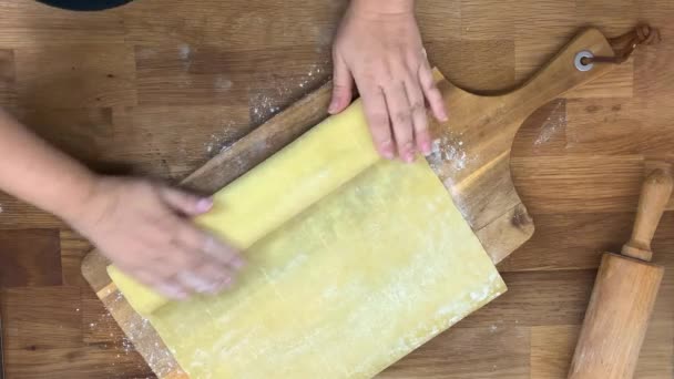 Woman Spreads Thin Rolls Dough Wooden Board Concept Cooking Homemade — Stockvideo