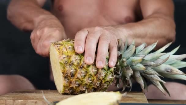 Tanned Old Man Decisively Slices Ripe Yellow Pineapple Concept Vegetarian — Stock Video