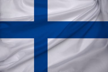 Finlandiya devletinin dokuma, turizm, ekonomi ve siyaset konsepti üzerine güzel renkli ulusal bayrağı, yakın plan