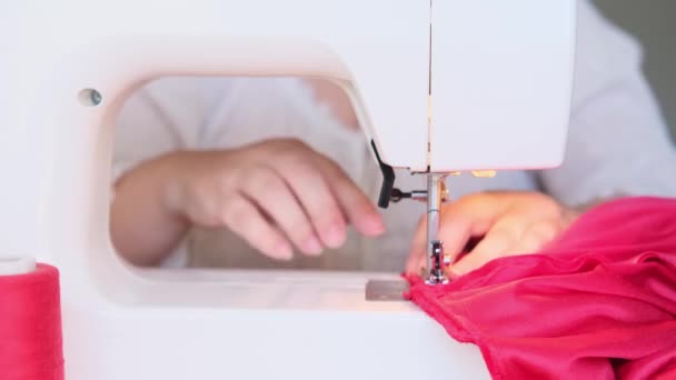 Red Velvet Cloth Threads Lie Modern Sewing Machine Selective Focus — Stock Video