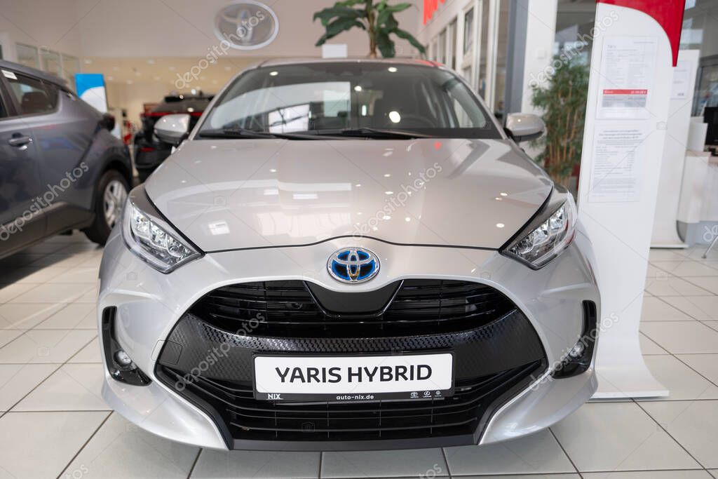 New silver Toyota Yaris Hybrid hatchback on display, modern urban automotive design, technological advancements automotive industry, environmental vehicle, Frankfurt, Germany - December 13, 2023