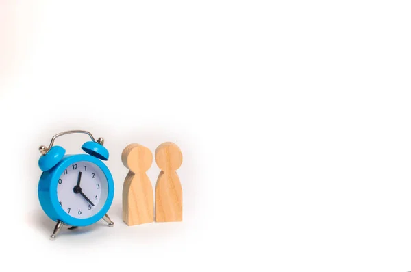 Two Wooden Figures People Standing Blue Alarm Clock White Background — Stock Photo, Image