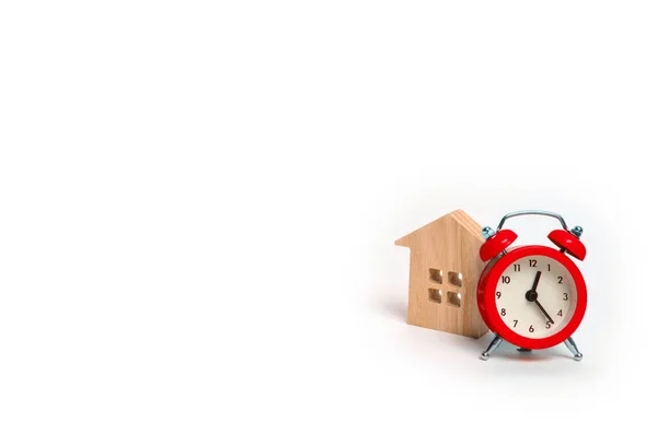 Wooden House Red Alarm Clock White Background Concept Rent Housing — Stock Photo, Image