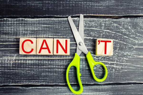 I can self motivation - cutting the letter t of the written word I can\'t so it says I can, goal achievement, potential, overcoming