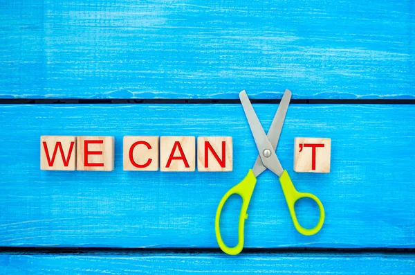 we can self motivation - cutting the letter t of the written word we can\'t so it says we can, goal achievement, potential, overcoming