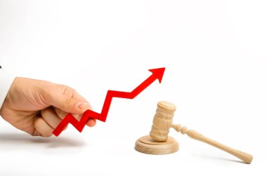 The hand holds the arrow up near the judge's hammer. The concept of increasing the percentage of disclosure of criminal cases, the last percent of accusatory or acquittal sentences. growth of crime. clipart