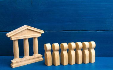 Gönüllüler, partiler, adaylar, seçim electorates. Seçici odak. ahşap insan figürleri üst üste hükümet kutusunda yanında dur. seçimler ve sosyal teknolojileri kavramı.