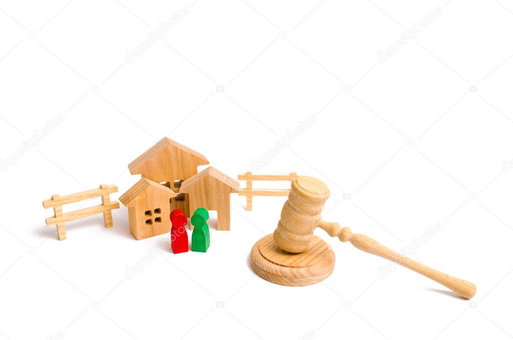 Wooden apartment house with people, keys and a judge hammer on a white background. The concept of laws and regulations for tenants and owners of a residential building. Condominiums.