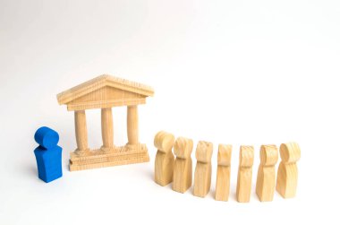 ahşap insan figürleri üst üste hükümet kutusunda yanında dur. seçimler ve sosyal teknolojileri kavramı. Gönüllüler, partiler, adaylar, seçim electorates. Seçici odak