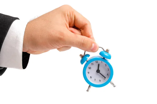 一个商人拿着一个闹钟 小心手 小时工资的概念 上班迟到了 全额或不完全率 加班工作 退休金和储蓄捐款 — 图库照片