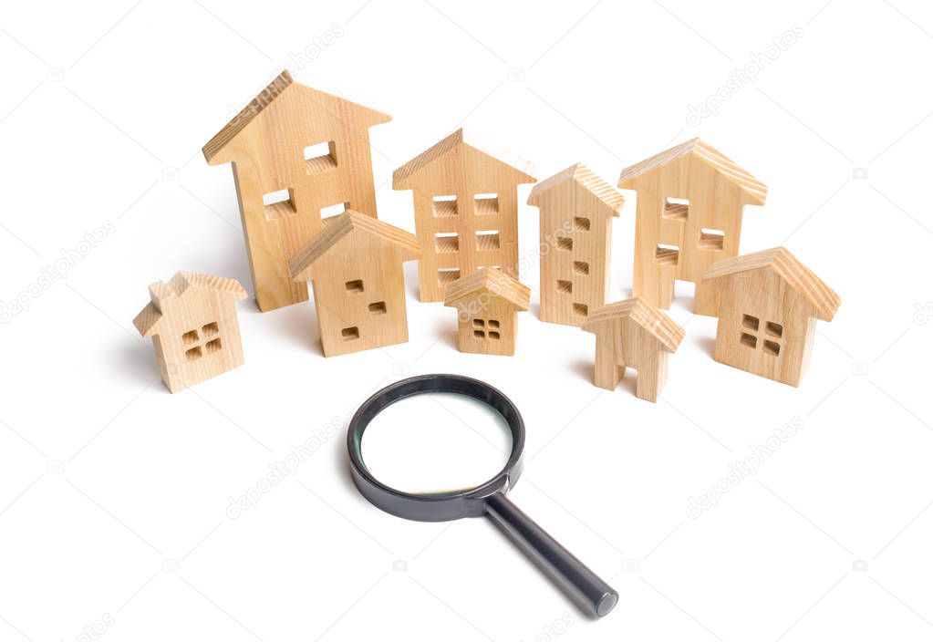 City of wooden houses on a white background. The concept of urban planning, infrastructure projects. Buying and selling real estate, building new buildings, offices and homes. House search