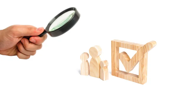 Magnifying Glass Looking Three Wooden Human Figures Stand Together Next — Fotografia de Stock