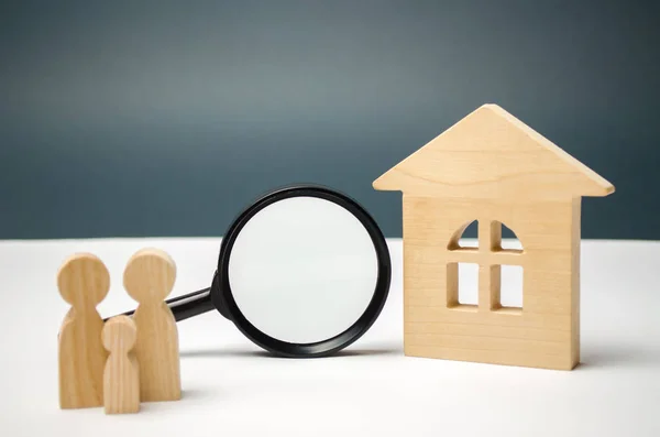 Wooden house and magnifying glass with family. Property valuation. Choice of location for the construction. House searching concept. Search for housing and apartments. Real estate concept. Appraisal