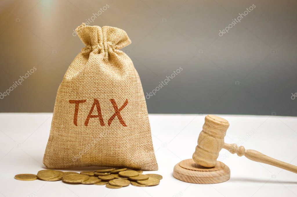 Bag of money and the word Tax and hammer of the judge. Law concept. Court and judgment. Justice and legality. Legislators, public administration. Property tax, house. Failure to pay taxes