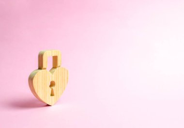 Padlock in the shape of a heart on a pink background. The secret of relationships and pickup rules. The concept of female intimate health. Strong love affair. Secrets, rumors and gossip.