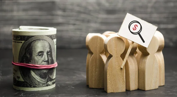 A crowd of people with a poster stand near the money. People in search of money. Attracting investment and affordable loan programs, search for funds and resources. Business group.