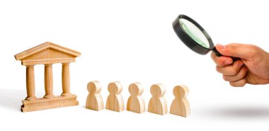 Magnifying glass is looking at the An ancient building and a lock. The concept of preserving monuments of history and culture. Protection of museums and government buildings. falsification of history.