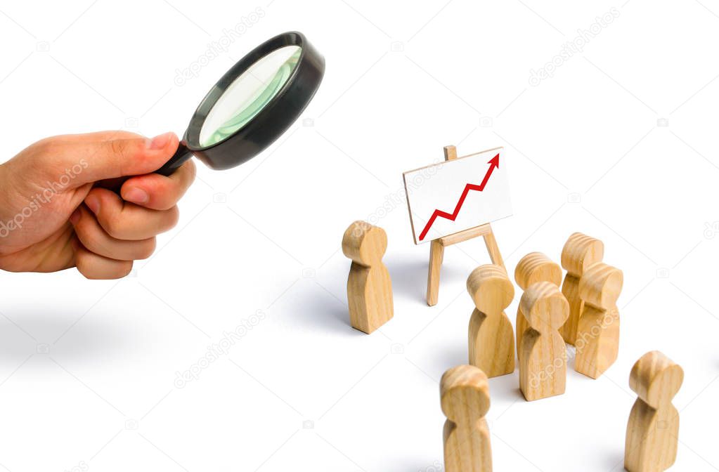 The leader is standing near the graph with a red up arrow speaks a speech addressing a crowd of people. Business concept of leader and leadership qualities, crowd management, political debate