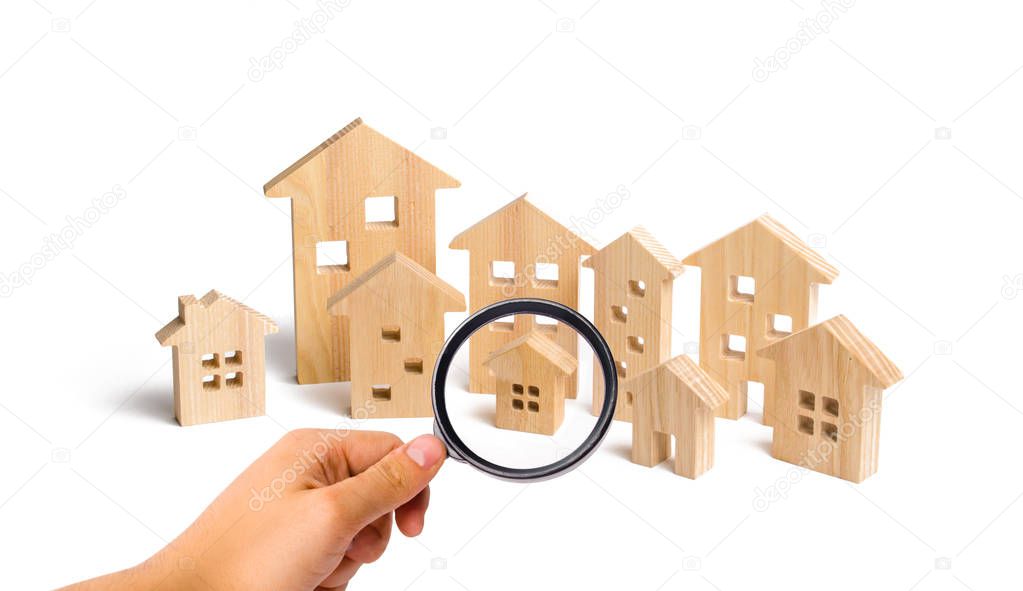 City of wooden houses on a white background. The concept of urban planning, infrastructure projects. Buying and selling real estate, building new buildings, offices and homes. Urban development.