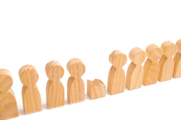 Did not give up to expectations and did not fulfill the task. Weak player, worker for dismissal. A row of wooden people and a broken figure of a person among them. The concept of a weak link.