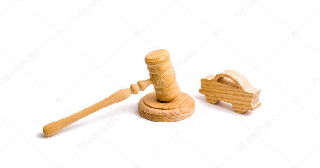 Wooden figurine of a car with a hammer of the judge on a white background. Minimalism. Purchase and sale of the car. The trial, confiscation of the machine. Recognition of ownership.