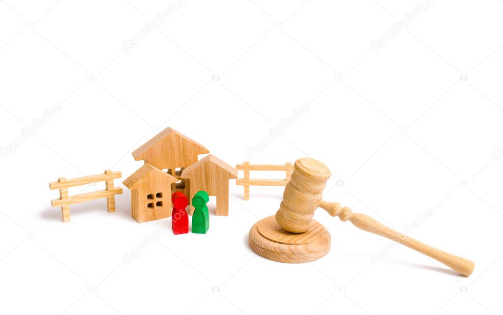 The concept of laws and regulations for tenants and owners of a residential building. Condominiums. Wooden apartment house with people, keys and a judge hammer on a white background.