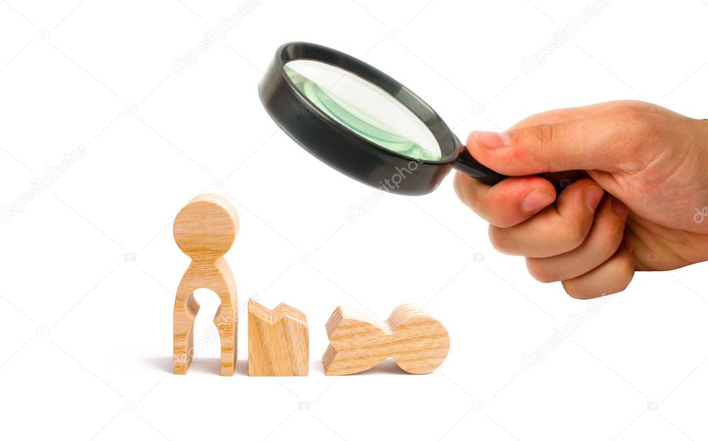 Magnifying glass is looking at a broken wooden human figure and a mother with a void in the body. Strife in the family. One parent is broken, addicted to drugs or alcohol, gaming addiction.