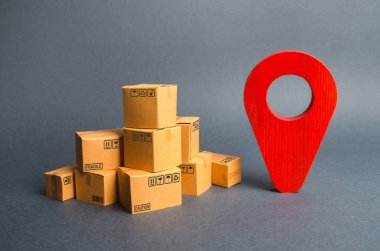 Bir yığın karton kutu ve kırmızı pozisyon pimi. Paketlerin ve malların yerini tespit etmek. Siparişlerin teslimi için minimum bir rota oluşturmak için algoritma. İnternet üzerinden parsel izleme.