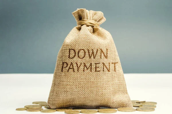 Money bag with the word down payment. Payment used in the context of the purchase of expensive items such as a car and a house, whereby the payment is the initial upfront portion of the total amount — Stock Photo, Image