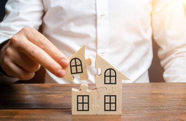 Bir adam bulmacalardan oluşan bir ev toplar. Kendi konut binanızın inşaatı. Mortgage kredisi, konut genişleme ve yaşam koşullarının iyileştirilmesi. Bir aile yaratmak. İstikrar kavramı