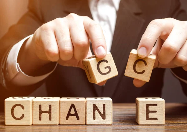 Businessman holding wooden blocks with the word Change to Chance. Personal development. Career growth or change yourself concept. Motivation, goal achievement, potential, incentive, overcoming