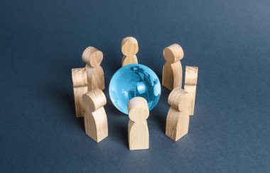 People surrounded a blue glass globe. Concept of cooperation and collaboration of people and countries around the world. The Big Eight. Outsourcing and joint work on projects. Diplomacy. crowdfunding clipart