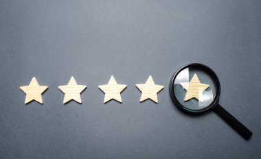 Five stars and a magnifying glass on the last star. Check the credibility of the rating or status of the institution, hotel, restaurant. Auditing, testing and certification. Getting the fifth star. clipart