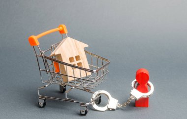 A person is handcuffed to a house on a supermarket cart. Financial dependence, unavailable housing for young families. Freeze of property. The concept of a large debt on a loan or mortgage. clipart
