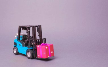 Blue forklift truck carries a pink gift box with a bow. Purchase and delivery of a present. retail, discounts and contests. contest promotions. Increase sales and attract new customers. clipart