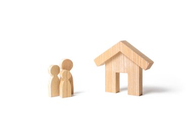 Wooden house and family. Buying a new home. Subsidy. Rental housing, investment. Mortgage and loans. Quiet and comfortable home in the suburbs. State program of assistance to young families.