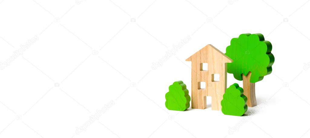 Wooden multi-storey building surrounded by bushes and trees on an isolated background. Acquisition of affordable housing in a mortgage. Accommodation for young families. Banner