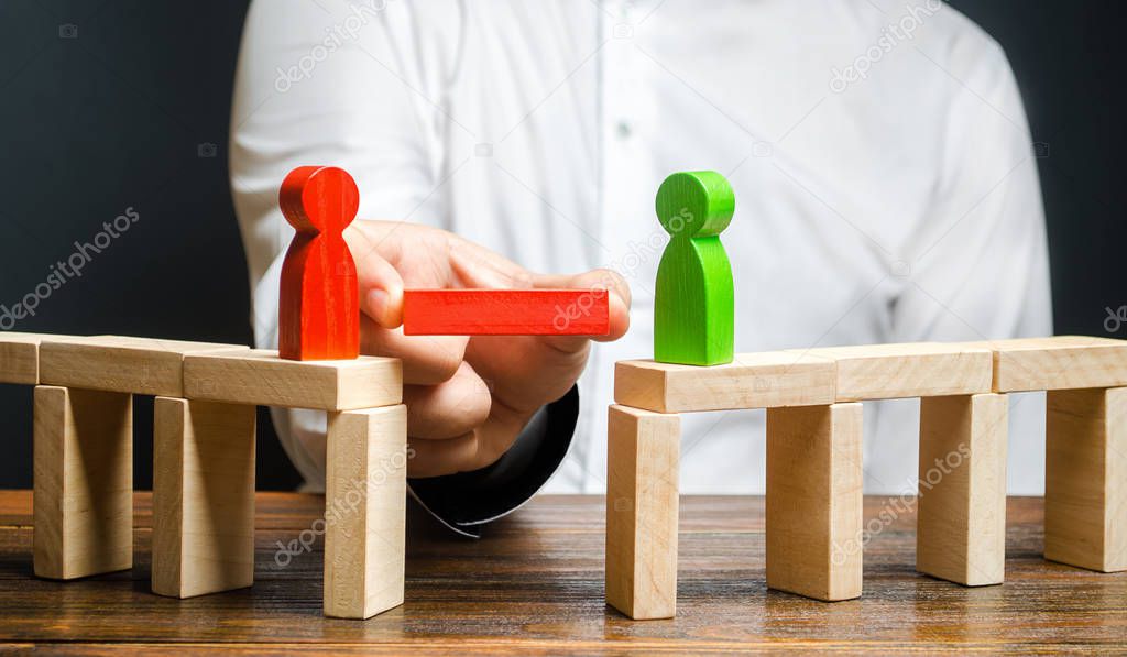 A man makes contact between people opponents. Arbitrator and mediator. Build bridges, seek a compromise in disputes and reconciliation of conflicts. Networking in business. Negotiation platform
