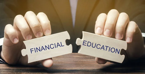 Wooden puzzles with the words Financial education. Learn investing and money management. Business and finance concept. Development and self-development. Solving financial decisions. Financial literacy