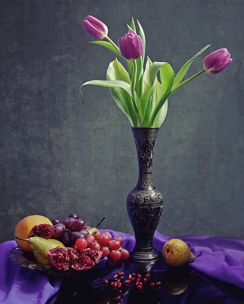 Still life with bouquet of  purple tulips