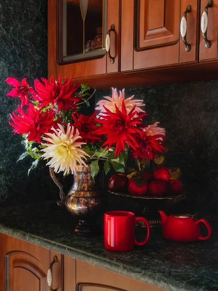 Still life with bouquet of dahlia on a kitchen