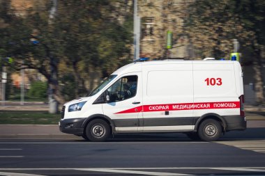 19.10.2018 Russia, Moscow. The car of health service of ambulance on city streets clipart