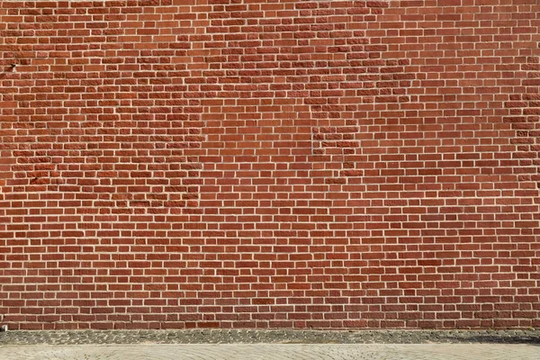 Saf kırmızı tuğla ve döşeli bir zemin bir duvardan Arka Plan — Stok fotoğraf