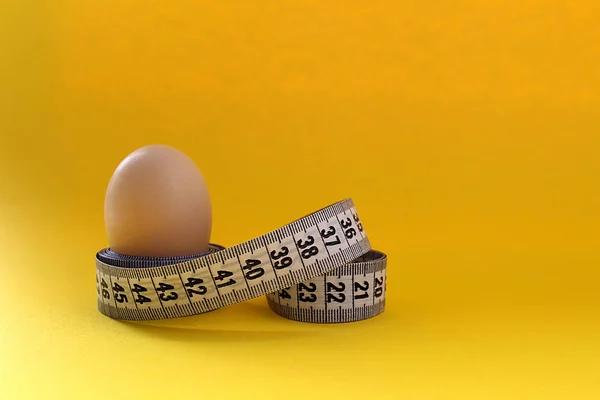 egg and centimeter ribbon protein diet background
