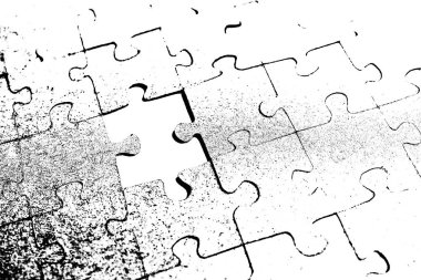 Masanın üzerinde gri bir arka plan üzerinde gri bulmacalar düzenlendiği