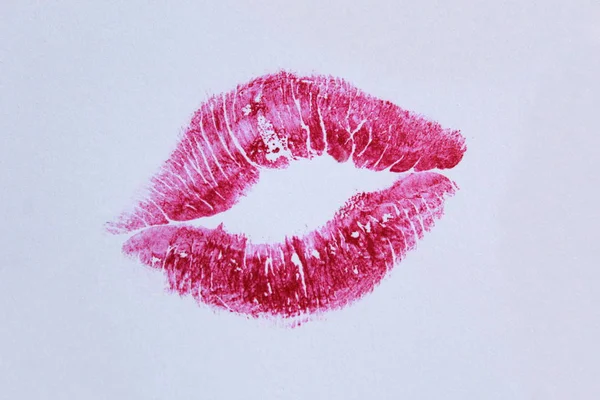 kiss many traces of lipstick on a light background