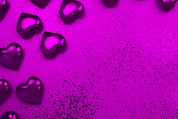 Purple hearts on a purple background