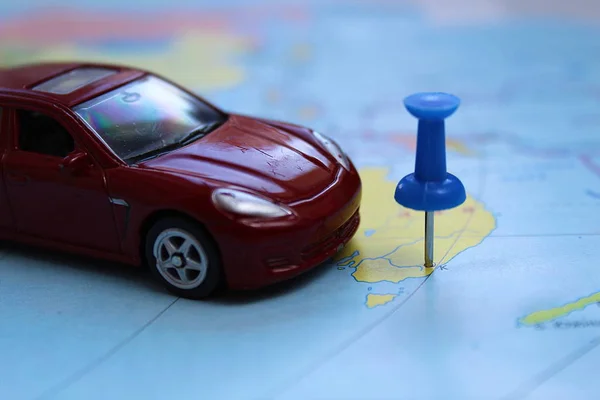 toy car is on a map with a destination