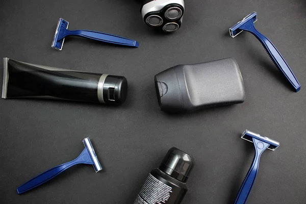 Men`s hygiene items are on a black background